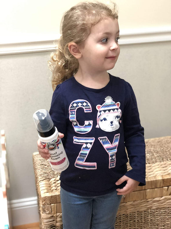 SoCozy Curl Volumizing Foam Curly Hair Girl Holding Product